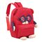 A menina caçoa a trouxa vermelha da criança dos sacos de escola apropriada para a vida diária da escola